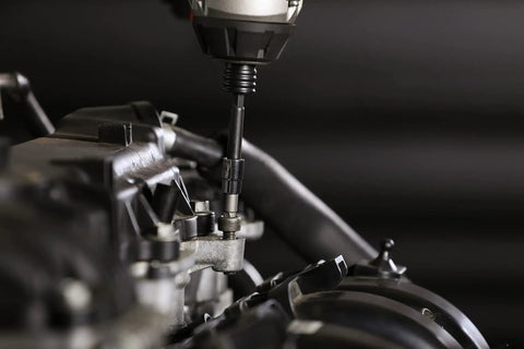 Close-up of Heavy Duty 14 Piece Metric Damaged Fastener Remover Hex Bit Socket Set in use on machinery.