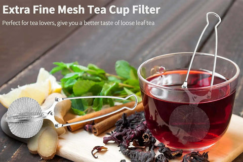 Stainless Steel Tea Infuser Ball Strainer With Handle 3 Pack Ultra Fine Mesh Filter with tea, herbs, and spices on wooden board