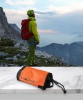 Rock Climbing Gear Bag With Adjustable Waist Belt 5L Pouch For Rope And Chalk Water Resistant Storage Sack Orange on table