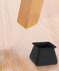 Silicone Chair Leg Protectors Non Slip Furniture Pads Set Of 16 shown beside wooden chair leg on hardwood floor