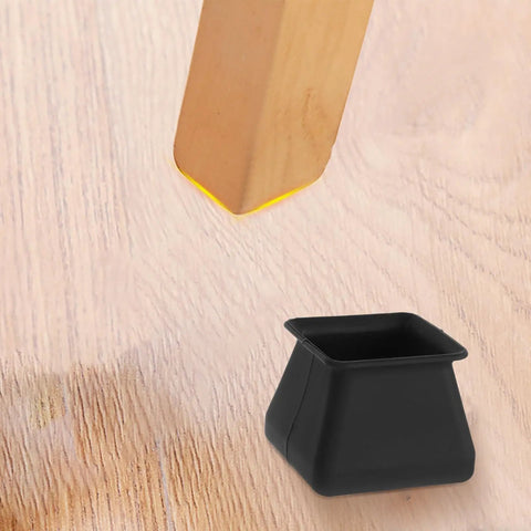 Silicone Chair Leg Protectors Non Slip Furniture Pads Set Of 16 shown beside wooden chair leg on hardwood floor