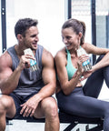 Two people at the gym holding Hydrogen Water Bottle Generator 2 Pack With SPE PEM Tech Water Ionizer Portable Hydrogen Rich Water Machine Improves Water In Just 3 Minutes Glass Bottle With Stainless Steel Accents Travel Ready