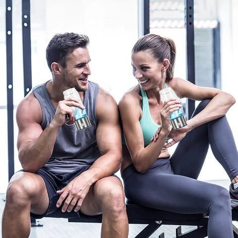 Two people at the gym holding Hydrogen Water Bottle Generator 2 Pack With SPE PEM Tech Water Ionizer Portable Hydrogen Rich Water Machine Improves Water In Just 3 Minutes Glass Bottle With Stainless Steel Accents Travel Ready