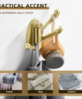Three Arm Brushed Gold Folding Swivel Towel Hook Space Saving Metal Towel Holder For Bathroom Robe And Coat Also Perfect RV Organizer Screw Mount Smooth Fold Easy Install No Closet Needed showing towel and clothes hanging.
