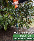 Green Outdoor Extension Cord 200 Ft 16 Gauge 3 SJTW Weatherproof Heavy Duty Cable in garden with green leaves in background