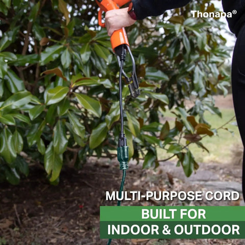 Green Outdoor Extension Cord 200 Ft 16 Gauge 3 SJTW Weatherproof Heavy Duty Cable in garden with green leaves in background