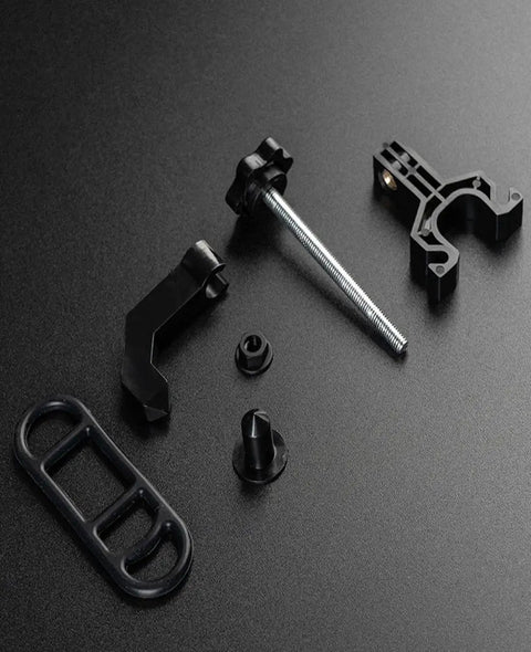 Ultra Portable Bike Wheel Truing Stand For On The Go Rim Adjustment, MTB and Road Bike Wheel Repair Tools, compact parts on black surface