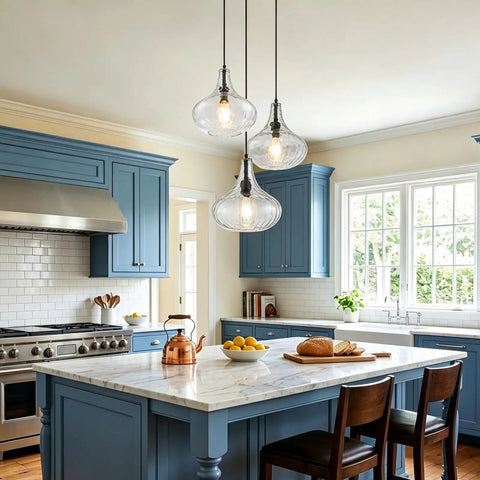 WILON 11" Hammered Glass Pendant Lights Kitchen Island Black hanging above a modern blue kitchen island with marble countertop.