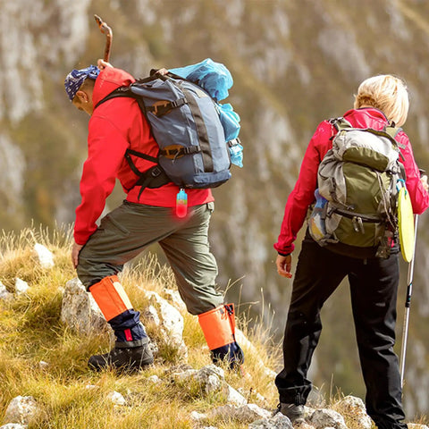 Two hikers wearing backpacks with gear including Scuba Dive Signal Light For Night Dives, High Visibility Underwater Marker Beacon