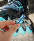 Top Grade Blue Alloy Roller Skate Hardware Kit Bearing Screws Bolts Fits Electric Skateboards And Inline Skates For Upgrade Mod Quick Install Durable Replacement Parts Keep Wheels Secure While Shredding Streets Every Day With Gear Ready To Ride, blue alloy bolt held near skate wheel