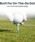 Golfer placing ball on Funny Golf Tees Set With Flip Open Box 18 Pack Premium Three And A Quarter Inch Tees for consistent height