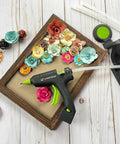 High Temperature Mini Hot Glue Gun With Fine Tip For Detailed Crafting And DIY Projects, Cordless For Quick Lifts Then Corded For Heavy Duty Use, 20 Watts, Precision Bonding Tool shown with floral crafts and stand