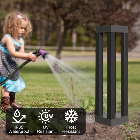 Child watering garden near Outdoor Solar Floor Lanterns Set Of 2, Stainless Steel Black Lantern Lights, weatherproof symbols visible.
