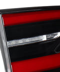 Close-up of Premium Grade Oem Style Left Inner Tail Light Replacement For 2016 Through 2020 Tesla Model X with red and black design.