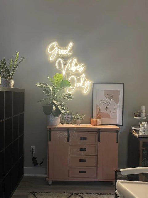 Good Vibes Only Neon Sign For Walls Large LED Neon Light above sideboard in modern room with plants, 56 by 13 inches warm white glow