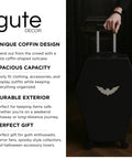 Coffin Shaped Carry On Luggage With Lock 26 Point 5 Inch Gothic Hard Shell Spinner Suitcase shown with hand on handle