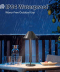 Modern LED Rechargeable Cordless Table Lamp With Dimmable Eye Protection Light, Battery Powered 240 Lumen Output shown outdoors in rain