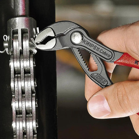 Cobra Water Pump Pliers, 5 Inch, Red, Adjustable Pliers With Self-Locking Teeth, 13 Positions used on a chain mechanism.