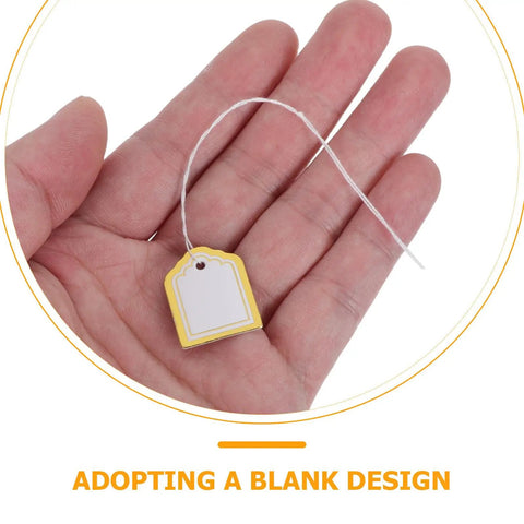 500 Pack Small Fan Shaped Price Tags With String For Clothing Jewelry Vendors Paper Tags With Writable Surface Great For Booths Crafting Stock Labels Gift Tags And Small Business Use For Your Shop. Small yellow paper price tag with string in hand