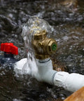 Tiny Half Inch Hydraulic Ram Pump For Off Grid Water Delivery From Creeks And Streams No Fuel Or Electricity Needed PVC Body With Lead Free Brass Waste Valve Ideal DIY Rural Water Pump in creek