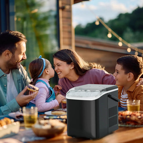 NEWBULIG countertop ice maker with handle, portable black ice machine on an outdoor table.