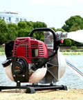 Heavy Duty Gasoline Mini Water Pump With High Lift Design And One Inch Port for efficient yard irrigation by a water body.