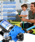 Heavy-Duty 7 GPM 70 PSI 110V Diaphragm Water Pump With Five Chamber Self Priming System in garden setting with family