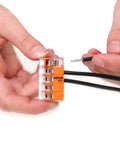 Skip The Tape Hassle With Five Conductor Lever Wire Connectors Clear Housing Quick Snap Levers No Twist 20 To 10 AWG Reusable Electrical Splicing Caps Bulk Bag Of Five Hundred Pieces in use, showing wires connecting.