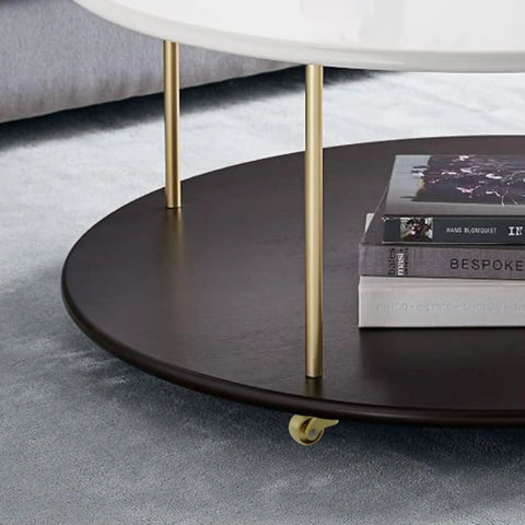 Round coffee table with a dark wooden top, brass legs, equipped with 4 Pack Heavy Duty Brass Stem Casters With 360 Degree Rotation For Trunk Box Furniture Cabinets Sofa Trolley And Bed Ultra Durable Smooth Rolling Casters For Home Office And Workshop.