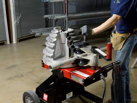 Gardner Bender B2000 Cyclone Electric Conduit Bender for 1/2 to 2 Inch EMT Rigid Al and IMC Pipe in use with operator.