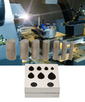 Drop Shaped Die Cutter Set For Jewelry Making 7 Piece Steel Disc Dies Pro tools in front of a metal forming machine.