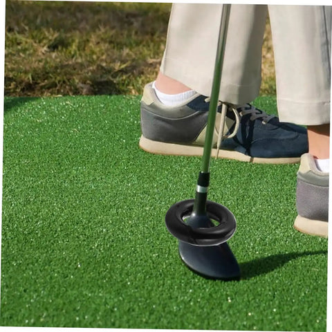 Close-up of Two Pack Weighted Golf Swing Trainer Rings For Beginners on club during warm-up on grass