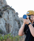 Person using 82mm Variable Neutral Density Filter PMVND Signature Edition II 2 To 5 Stop VND For DSLR And Mirrorless Cameras