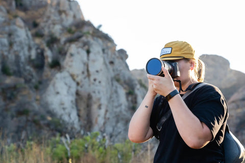 Person using 82mm Variable Neutral Density Filter PMVND Signature Edition II 2 To 5 Stop VND For DSLR And Mirrorless Cameras
