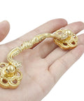 Person holding gold drop bail drawer pull, part of 4 pack 120mm cabinet handles, modern dresser hardware. Durable zinc alloy, rust resistant.