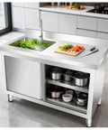 Top Shelf Heavy Duty Stainless Steel Kitchen Workbench With Integrated Sink And Smooth Sliding Cabinets Rock Solid Prep Table for food prep.