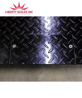 Heavy Duty Digital Pallet Scale With 5000 Pound Capacity And Roomy 48 By 48 Deck textured steel deck close-up showing durable surface.