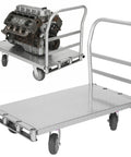 Heavy Duty Platform Truck Badass Heavy Hitter Rig With Four Smooth Swivel Wheels, transporting an engine on a steel platform.