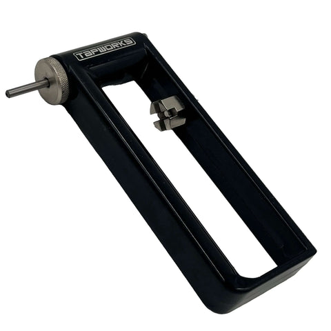 Adjustable sheet metal hole cutter tool in black metal frame with knurled adjustment knob, front view