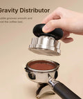 Gravity distributor tool being used with portafilter in hand for the Ultimate Espresso Tamper Set For 58.4Mm Portafilters With Self Leveling Weight Orbital Wdt Tool And Gravity Distributor Pro Barista Gear To Nail Every Pull Smooth Crema And Zero Mess No Sweat Pure Grind Mastery Now.