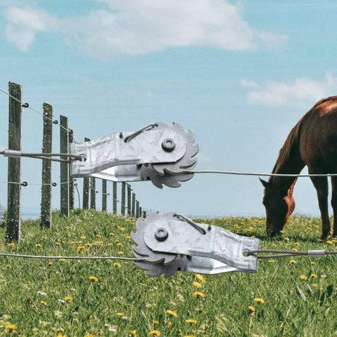 Heavy Duty Inline Wire Tensioner Kit For Electric Fences And Farm Fencing, shown installed on a wire with field and horse in background.