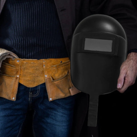Handheld Welding Helmet With Flip Up Movable Lens Anti Glare Welder Mask held by person in tool belt