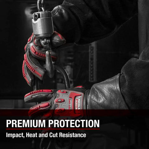 Person wearing Roll Cage Welding And Rigging Gloves With Impact Protection Black Grain Leather High Heat Silicone Reinforcements And Cut Resistant Grippy Grip For Welders X Large handling heavy equipment in black and red.