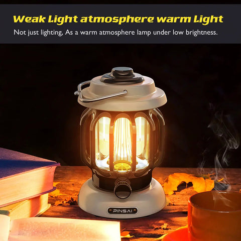 Led Camping Lantern With Rechargeable Battery And Retro Metal Construction, warm light setting, on wooden table with books.