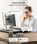 Woman using computer with voice control for Slick WiFi Smart Deadbolt And Keyless Entry Door Lock With No Sweat App Connect.