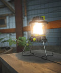 600 Lumen Multi Functional Go To Camping Lantern with USB Charging and Emergency Power on wooden table, night use