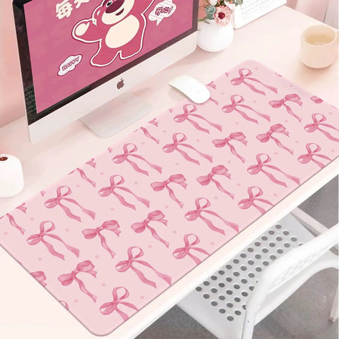 Large Pink Bow Desk Mat For Women 31.5 Inch Non Slip Keyboard And Mouse Pad With Stitched Edge on a desk with computer and accessories