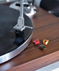 Image of Audio-Technica At-Lpw50bt-Rw Manual Belt-Drive Turntable In Slick Rosewood With Bluetooth Wireless Tech, featuring black vinyl and stylus.