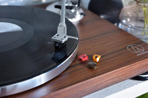 Image of Audio-Technica At-Lpw50bt-Rw Manual Belt-Drive Turntable In Slick Rosewood With Bluetooth Wireless Tech, featuring black vinyl and stylus.