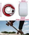 Close-up of red 52mm x 32mm skateboard wheels with wide contact patch and recessed edges for smooth glide on street and park.